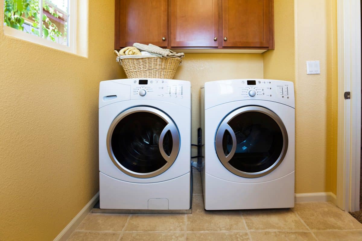 White modern washer and dryer in home's laundry room